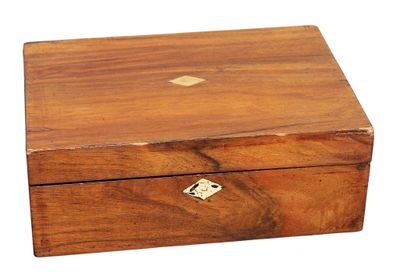 a small wooden box with a key in it