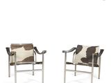 pair of chrome and cowhide lounge chairs