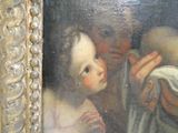 a painting of a woman holding a baby in her lap