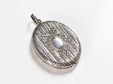 an image of a silver locke with a stone in the center