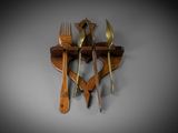 a wooden spoon and fork hanging on a wall