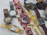 a lot of watches that are laying on a table