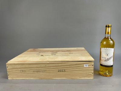 an empty bottle of wine next to a wooden box on a table