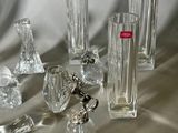 a lot of glass vases on a table with a keychain