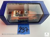 une image représentant une petite voiture dans une boîte, avec une étiquette de prix dessus