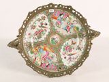 a plate with a decorative design on it sitting on a table