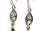 silver plated earrings with clear crystal stones hanging from them