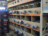 many shelves with different types of pipes in a warehouse