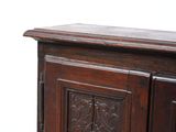 a wooden cabinet with a door on top of it