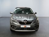 the front view of a grey car in a showroom