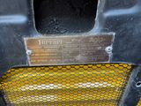 a close up view of a car ' s front bumper with a sign on it