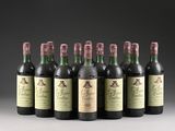 six bottles of wine are lined up in a row on a table