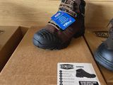 two pairs of shoes that are on top of a box