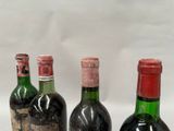 three bottles of wine sitting next to each other on a table
