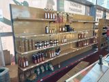 many bottles of wine on the shelves in the store