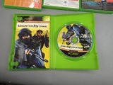 the xbox game is sitting on a table next to a cd case