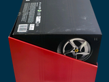 a red box with a wheel inside of it