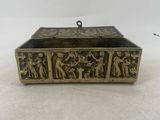 an antique brass box with a scene of a man and a woman