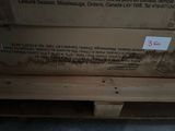a stack of boxes sitting on top of a wooden pallet