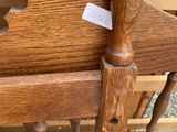 a wooden chair that has a sticker on it