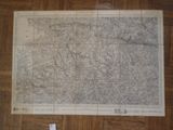 an old map on a wooden floor with a piece of paper on the floor
