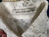 the back of a woman ' s dress with a label on it