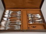 six spoons in a wooden box with silverware in it