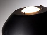a black table lamp with a white light on it