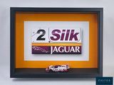 a picture of a picture of a race car in a shadow box