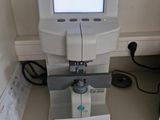 a machine that is sitting on a table with a sign on it