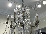 a chandelier hanging from the ceiling in a living room