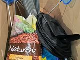 a cardboard box filled with cleaning supplies and other items