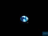 a blue topaz gems on a black background