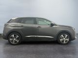 the grey car is parked on the concrete floor in the room