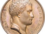 une vieille pièce de monnaie sur laquelle figure une tête de femme