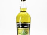 a bottle of chartreuse lemon liqueur on a white surface