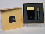 black and gold perfume set in a gold box on a white surface