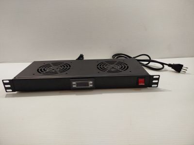 a close up of a computer power supply on a white surface