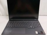a close up of a laptop computer on a white surface