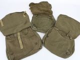 three bags are lined up on a white surface, one has a brown tag on it