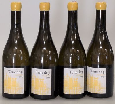 three bottles of wine sitting next to each other on a table