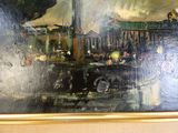 une peinture accrochée au mur d'un immeuble, sur laquelle figure une horloge