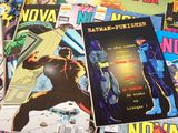 many comic books on a table with a lot of them