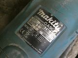 a close up of a blue machine with a sticker on it ' s side