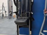 a gym equipment that is in a room with a blue wall