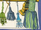 a picture of a scarf with a bunch of tassels hanging from it