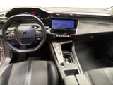 the interior of a car with a steering wheel, dashboard, and dashboard controls