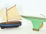 two model boats that are sitting next to each other