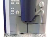 une image représentant une machine à café sur laquelle est posée une tasse