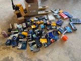 a pile of assorted items on the floor of a warehouse